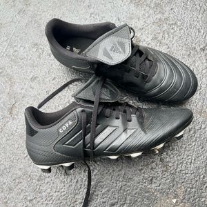 Mens adidas black cleats.